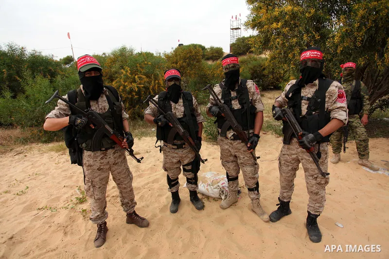 Palestinian militants take part in an anti-Israel joint drill by National Resistance Brigades and Abdel Qader al Husseini Brigades in Khan Younis in the southern Gaza Strip March 25, 2016. Photo by Ashraf Amra