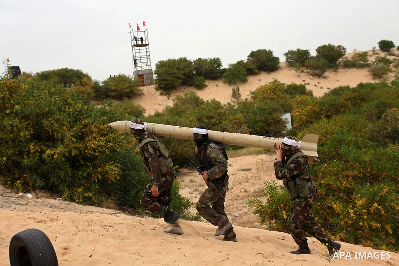 Palestinian militants show a home-made rocket to the media during an anti-Israel joint drill by National Resistance Brigades and Abdel Qader al Husseini Brigades in Khan Younis in the southern Gaza Strip March 25, 2016....