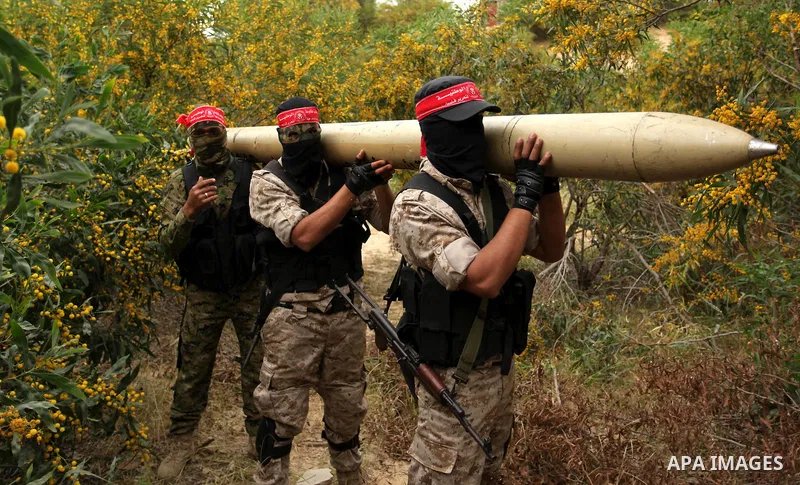 Palestinian militants show a home-made rocket to the media during an anti-Israel joint drill by National Resistance Brigades and Abdel Qader al Husseini Brigades in Khan Younis in the southern Gaza Strip March 25, 2016....