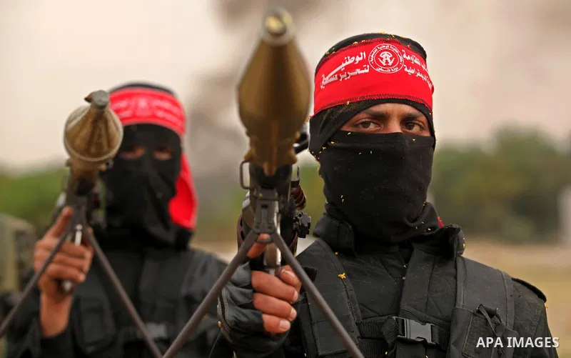 Palestinian militants take part in an anti-Israel joint drill by National Resistance Brigades and Abdel Qader al Husseini Brigades in Khan Younis in the southern Gaza Strip March 25, 2016. Photo by Ashraf Amra