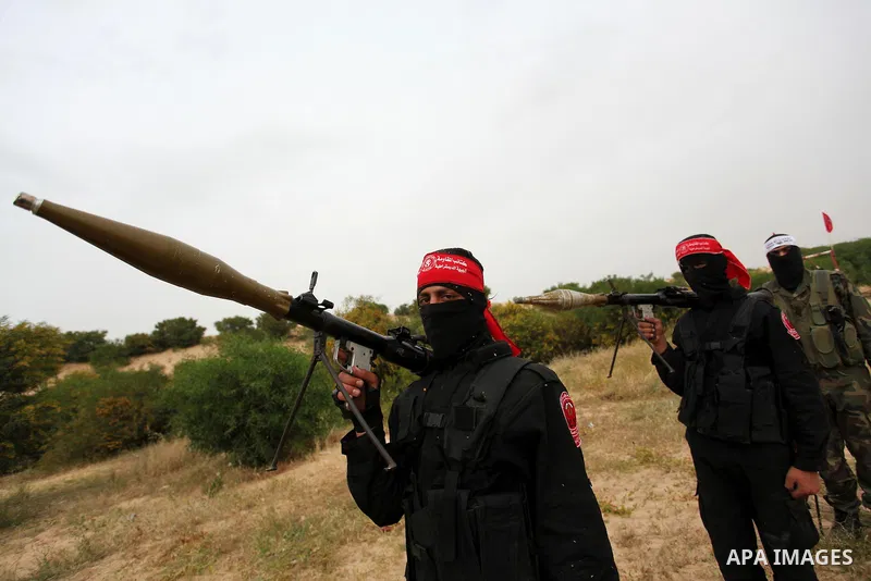 Palestinian militants take part in an anti-Israel joint drill by National Resistance Brigades and Abdel Qader al Husseini Brigades in Khan Younis in the southern Gaza Strip March 25, 2016. Photo by Ashraf Amra
