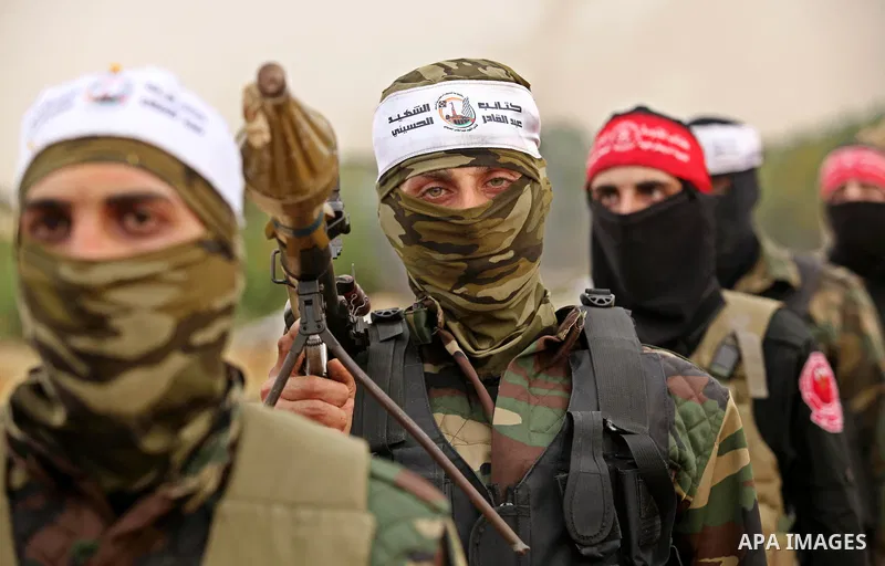 Palestinian militants take part in an anti-Israel joint drill by National Resistance Brigades and Abdel Qader al Husseini Brigades in Khan Younis in the southern Gaza Strip March 25, 2016. Photo by Ashraf Amra