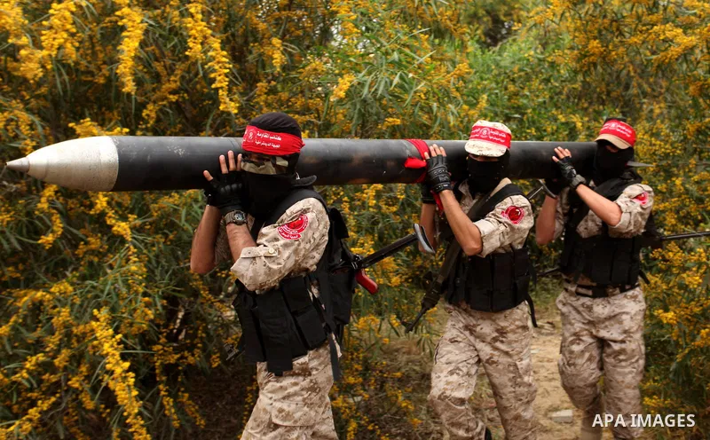 Palestinian militants show a home-made rocket to the media during an anti-Israel joint drill by National Resistance Brigades and Abdel Qader al Husseini Brigades in Khan Younis in the southern Gaza Strip March 25, 2016....
