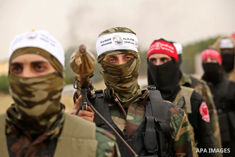 Palestinian militants take part in an anti-Israel joint drill by National Resistance Brigades and Abdel Qader al Husseini Brigades in Khan Younis in the southern Gaza Strip March 25, 2016. Photo by Ashraf Amra