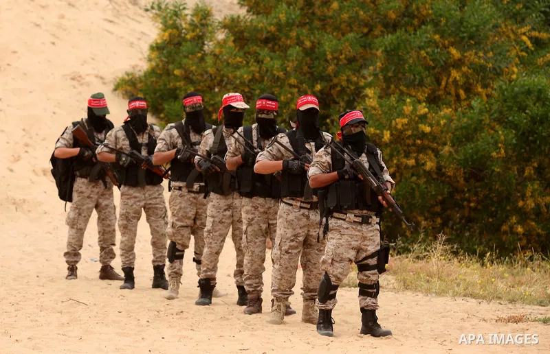 Palestinian militants take part in an anti-Israel joint drill by National Resistance Brigades and Abdel Qader al Husseini Brigades in Khan Younis in the southern Gaza Strip March 25, 2016. Photo by Ashraf Amra