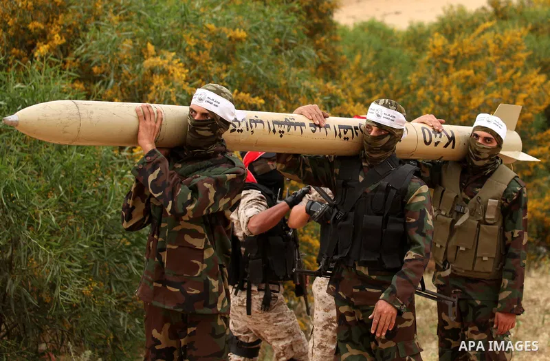 Palestinian militants show a home-made rocket to the media during an anti-Israel joint drill by National Resistance Brigades and Abdel Qader al Husseini Brigades in Khan Younis in the southern Gaza Strip March 25, 2016....