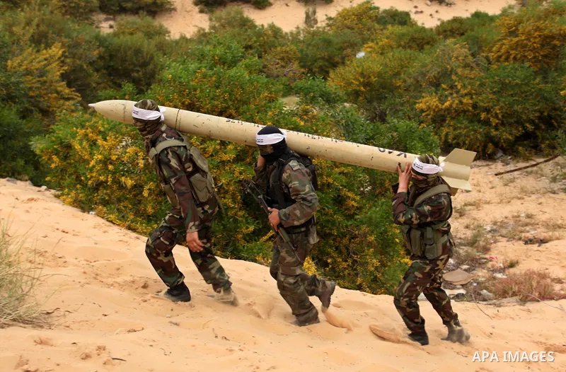 Palestinian militants show a home-made rocket to the media during an anti-Israel joint drill by National Resistance Brigades and Abdel Qader al Husseini Brigades in Khan Younis in the southern Gaza Strip March 25, 2016....
