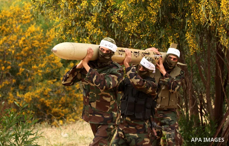 Palestinian militants show a home-made rocket to the media during an anti-Israel joint drill by National Resistance Brigades and Abdel Qader al Husseini Brigades in Khan Younis in the southern Gaza Strip March 25, 2016....