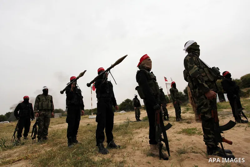 Palestinian militants take part in an anti-Israel joint drill by National Resistance Brigades and Abdel Qader al Husseini Brigades in Khan Younis in the southern Gaza Strip March 25, 2016. Photo by Ashraf Amra