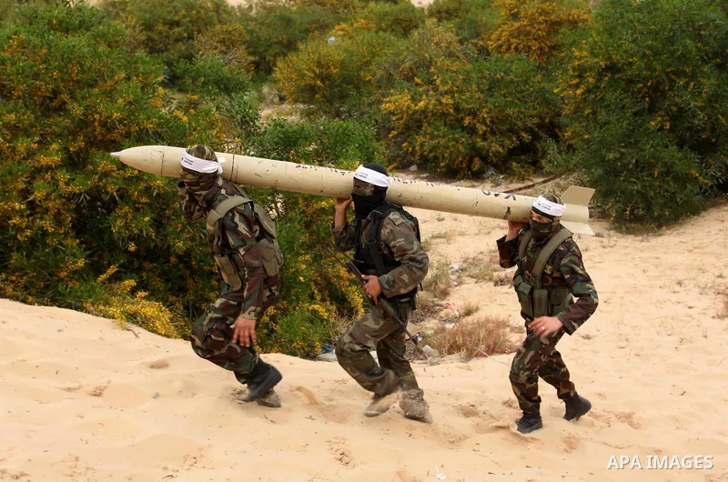 Palestinian militants show a home-made rocket to the media during an anti-Israel joint drill by National Resistance Brigades and Abdel Qader al Husseini Brigades in Khan Younis in the southern Gaza Strip March 25, 2016....
