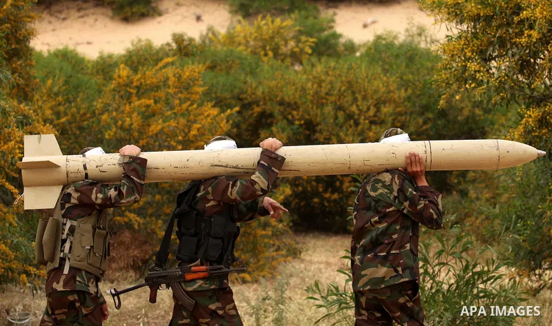 Palestinian militants show a home-made rocket to the media during an anti-Israel joint drill by National Resistance Brigades and Abdel Qader al Husseini Brigades in Khan Younis in the southern Gaza Strip March 25, 2016....