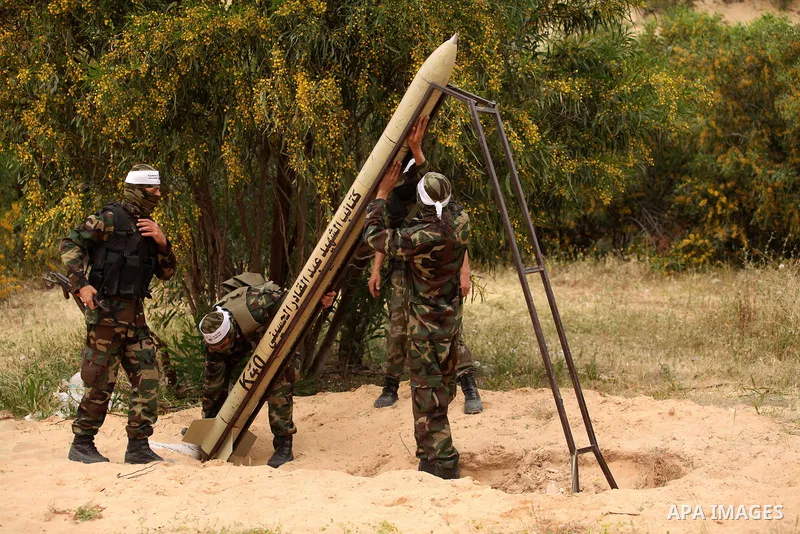 Palestinian militants show a home-made rocket to the media during an anti-Israel joint drill by National Resistance Brigades and Abdel Qader al Husseini Brigades in Khan Younis in the southern Gaza Strip March 25, 2016....