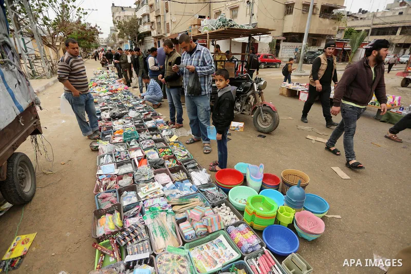 Palestinian vendors display all kinds of used goods at El-Yarmouk market in Gaza city, on March 26, 2016. Photo by Mohammed Asad