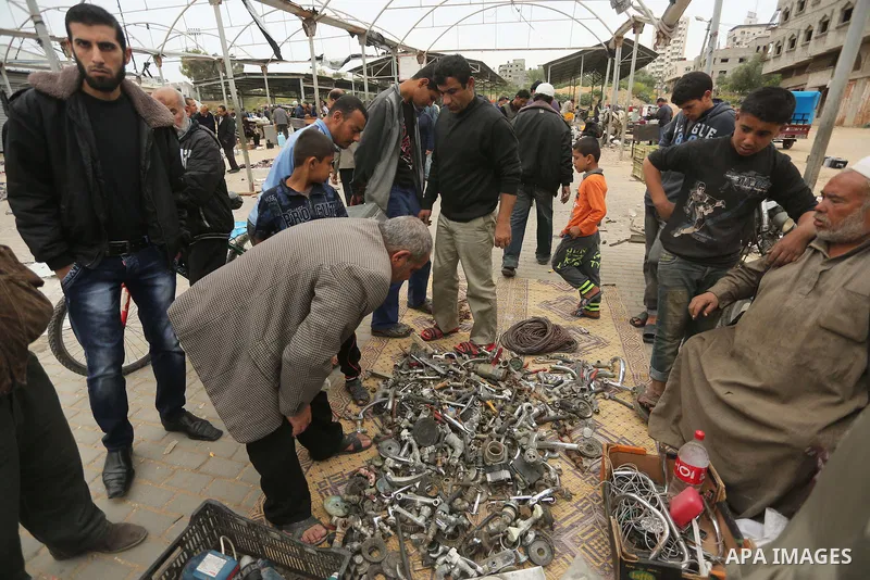 Palestinian vendors display all kinds of used goods at El-Yarmouk market in Gaza city, on March 26, 2016. Photo by Mohammed Asad