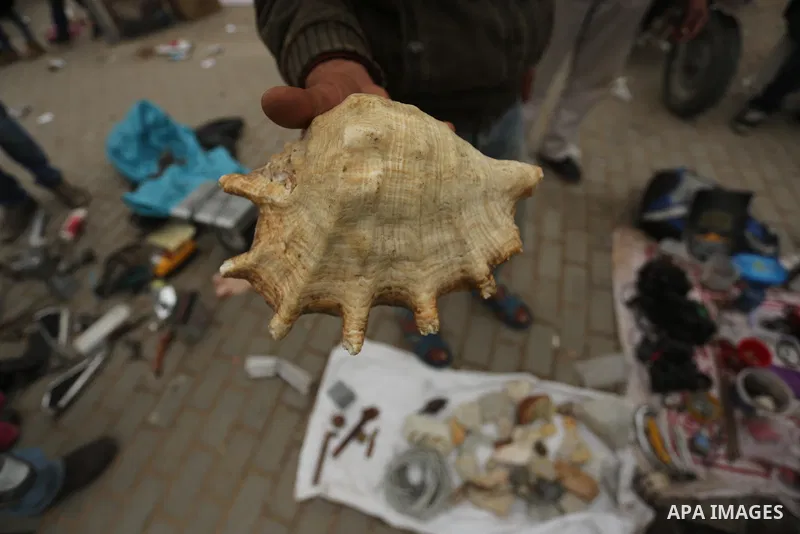 Palestinian vendors display all kinds of used goods at El-Yarmouk market in Gaza city, on March 26, 2016. Photo by Mohammed Asad