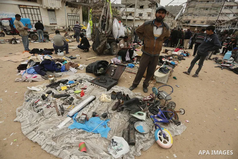 Palestinian vendors display all kinds of used goods at El-Yarmouk market in Gaza city, on March 26, 2016. Photo by Mohammed Asad