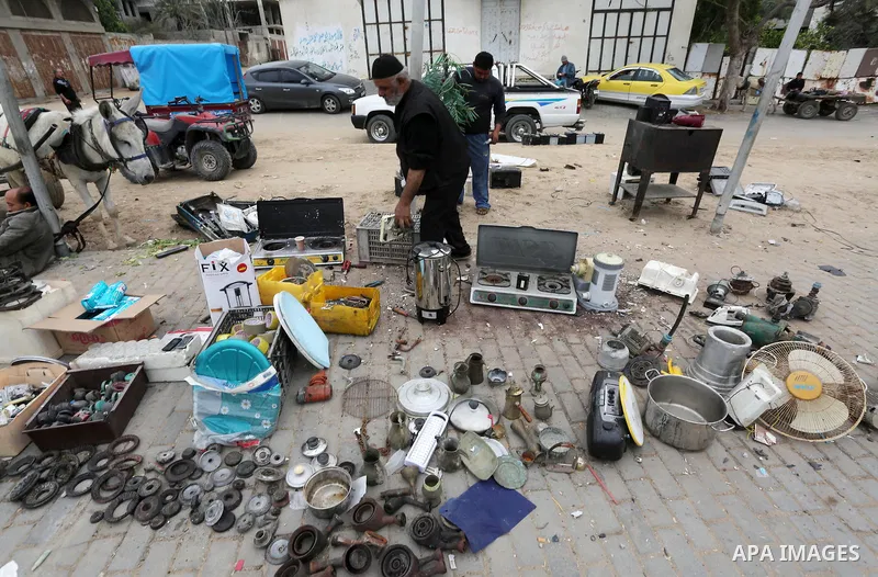 Palestinian vendors display all kinds of used goods at El-Yarmouk market in Gaza city, on March 26, 2016. Photo by Mohammed Asad