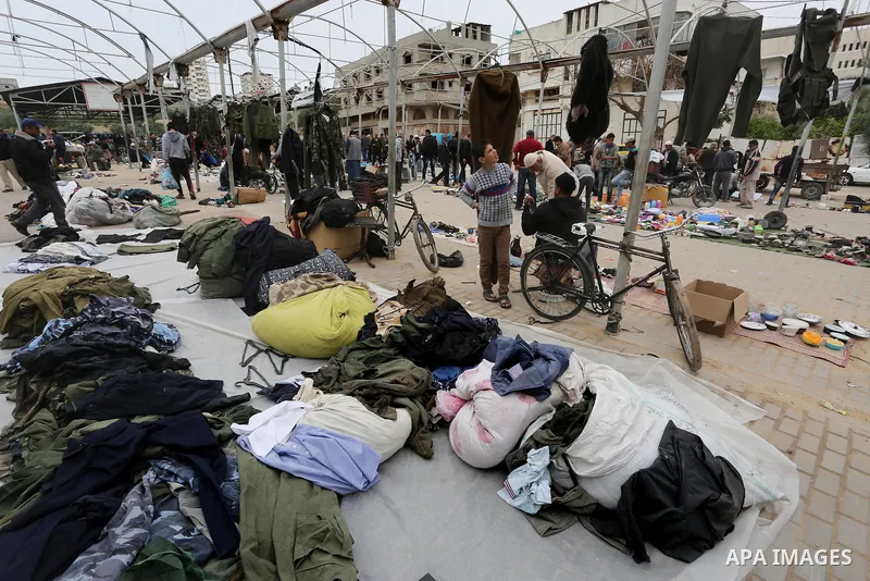 Palestinian vendors display all kinds of used goods at El-Yarmouk market in Gaza city, on March 26, 2016. Photo by Mohammed Asad
