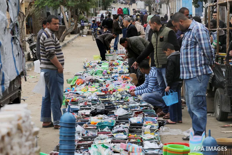 Palestinian vendors display all kinds of used goods at El-Yarmouk market in Gaza city, on March 26, 2016. Photo by Mohammed Asad
