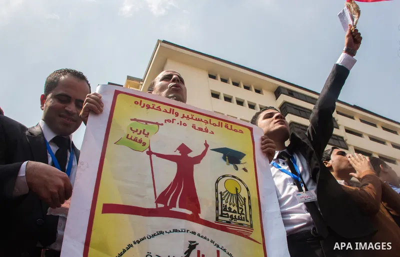 Egyptians Who obtained a master's degree take part in a protest to demand jobs in Cairo, Egypt, on March 27, 2016. Photo by Amr Sayed