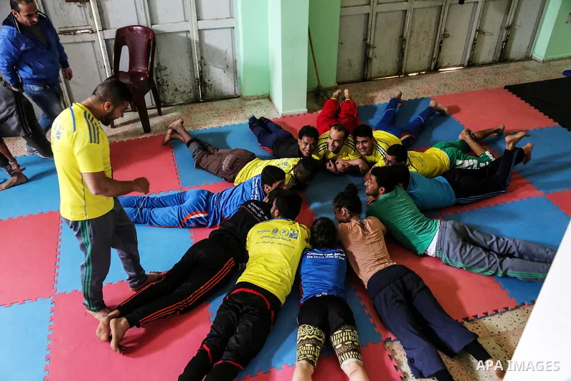 An Italian delegation train Palestinian youths at a Palestinian Circus School in Beit Lahiya in the north of the Gaza strip on March 27, 2016. Photo by Nidal Alwaheidi