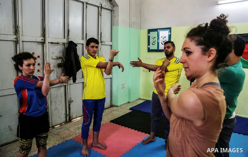 An Italian delegation train Palestinian youths at a Palestinian Circus School in Beit Lahiya in the north of the Gaza strip on March 27, 2016. Photo by Nidal Alwaheidi