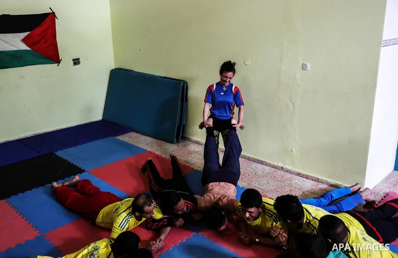 An Italian delegation train Palestinian youths at a Palestinian Circus School in Beit Lahiya in the north of the Gaza strip on March 27, 2016. Photo by Nidal Alwaheidi