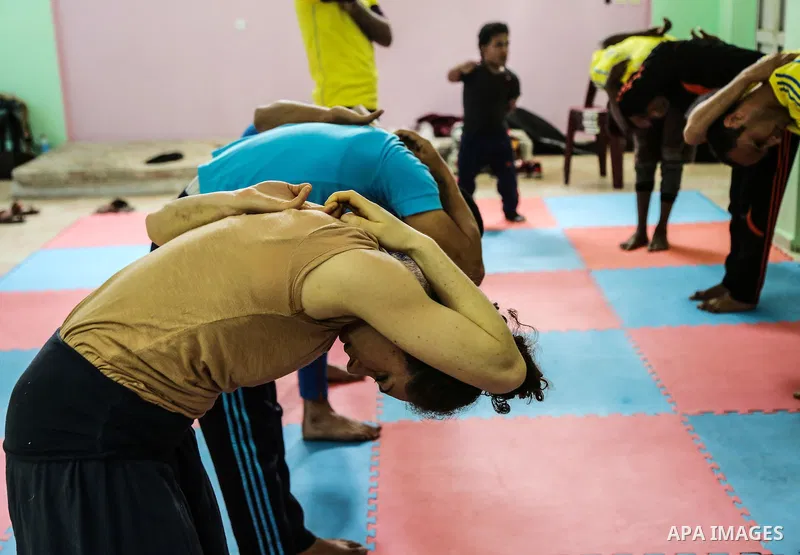 An Italian delegation train Palestinian youths at a Palestinian Circus School in Beit Lahiya in the north of the Gaza strip on March 27, 2016. Photo by Nidal Alwaheidi