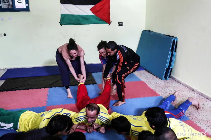 An Italian delegation train Palestinian youths at a Palestinian Circus School in Beit Lahiya in the north of the Gaza strip on March 27, 2016. Photo by Nidal Alwaheidi