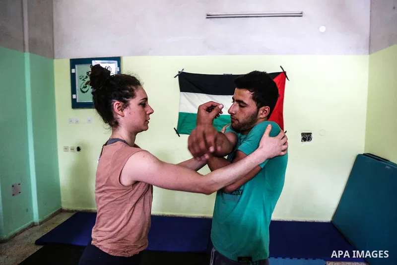 An Italian delegation train Palestinian youths at a Palestinian Circus School in Beit Lahiya in the north of the Gaza strip on March 27, 2016. Photo by Nidal Alwaheidi