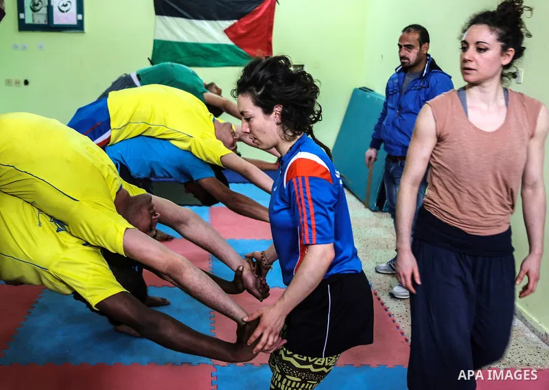 An Italian delegation train Palestinian youths at a Palestinian Circus School in Beit Lahiya in the north of the Gaza strip on March 27, 2016. Photo by Nidal Alwaheidi