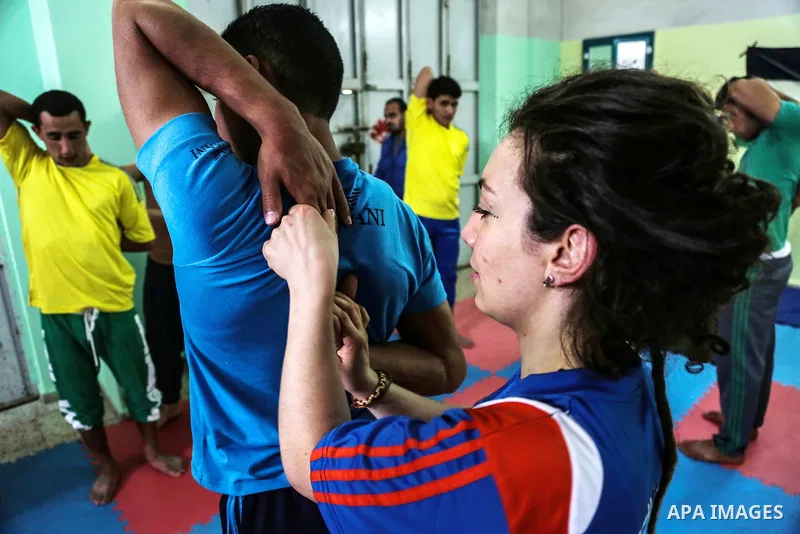 An Italian delegation train Palestinian youths at a Palestinian Circus School in Beit Lahiya in the north of the Gaza strip on March 27, 2016. Photo by Nidal Alwaheidi
