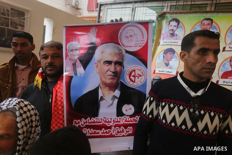 Palestinians take part in a protest demanding release the prisoners in Israeli jails, in front of Red cross office, in Gaza city, on March 28, 2016. Photo by Mohammed Asad