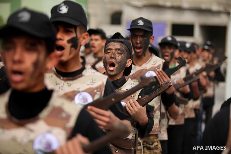 Palestinian students demonstrate their skills during a military-style show at a school in Rafah in the southern Gaza Strip March 28, 2016. Photo by Ashraf Amra