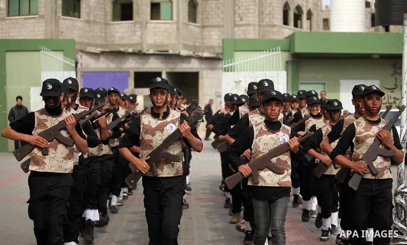Palestinian students demonstrate their skills during a military-style show at a school in Rafah in the southern Gaza Strip March 28, 2016. Photo by Ashraf Amra