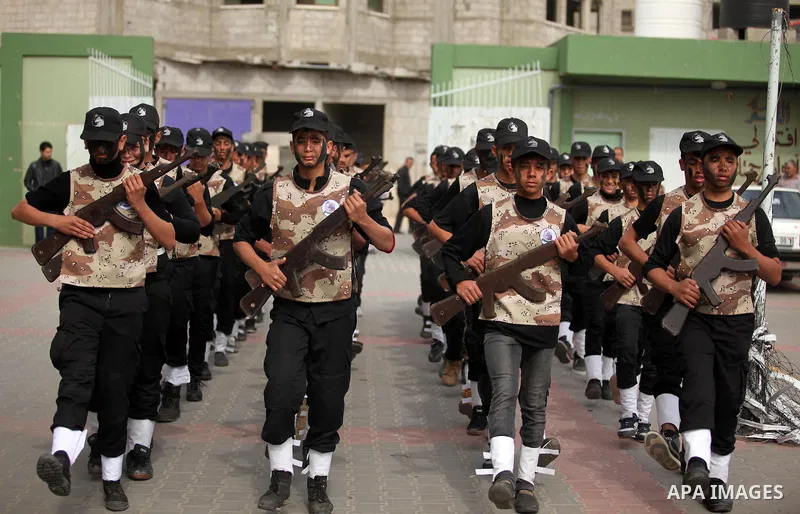 Palestinian students demonstrate their skills during a military-style show at a school in Rafah in the southern Gaza Strip March 28, 2016. Photo by Ashraf Amra