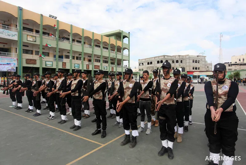 Palestinian students demonstrate their skills during a military-style show at a school in Rafah in the southern Gaza Strip March 28, 2016. Photo by Ashraf Amra