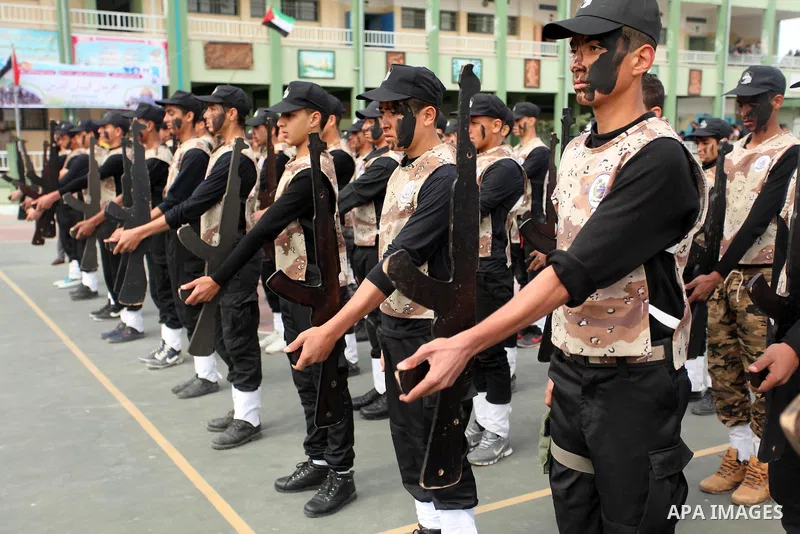 Palestinian students demonstrate their skills during a military-style show at a school in Rafah in the southern Gaza Strip March 28, 2016. Photo by Ashraf Amra