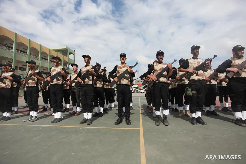Palestinian students demonstrate their skills during a military-style show at a school in Rafah in the southern Gaza Strip March 28, 2016. Photo by Ashraf Amra