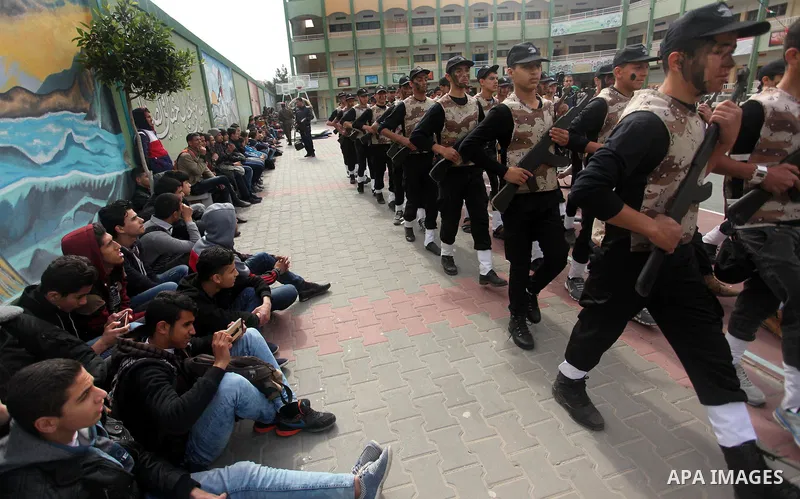 Palestinian students demonstrate their skills during a military-style show at a school in Rafah in the southern Gaza Strip March 28, 2016. Photo by Ashraf Amra