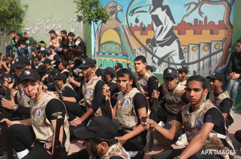 Palestinian students demonstrate their skills during a military-style show at a school in Rafah in the southern Gaza Strip March 28, 2016. Photo by Ashraf Amra