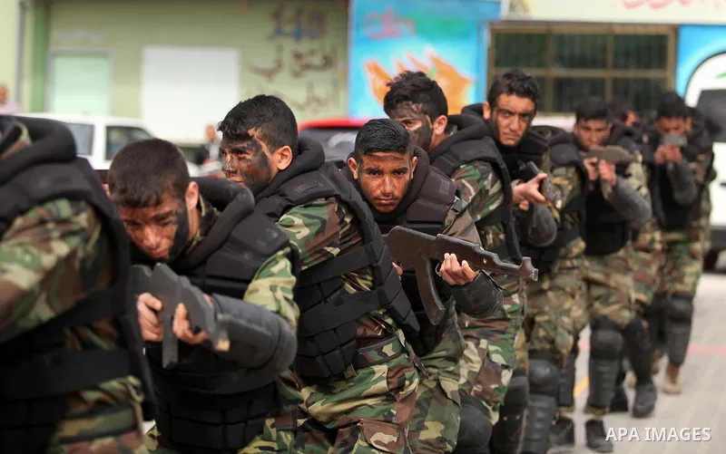 Palestinian students demonstrate their skills during a military-style show at a school in Rafah in the southern Gaza Strip March 28, 2016. Photo by Ashraf Amra