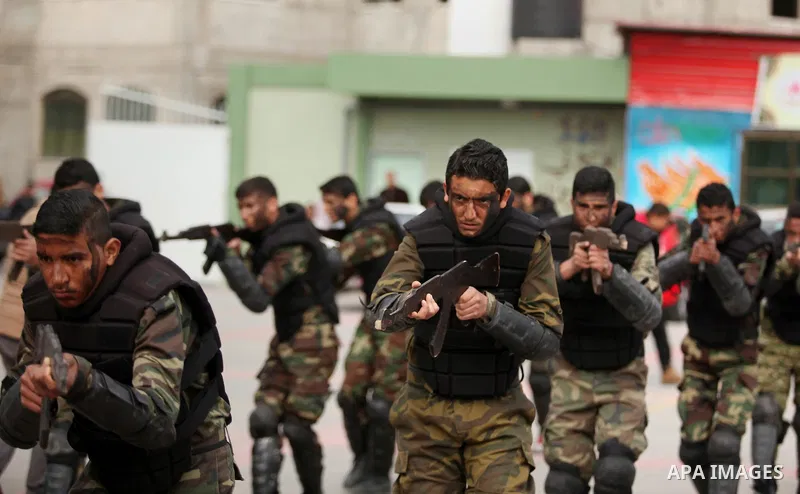 Palestinian students demonstrate their skills during a military-style show at a school in Rafah in the southern Gaza Strip March 28, 2016. Photo by Ashraf Amra
