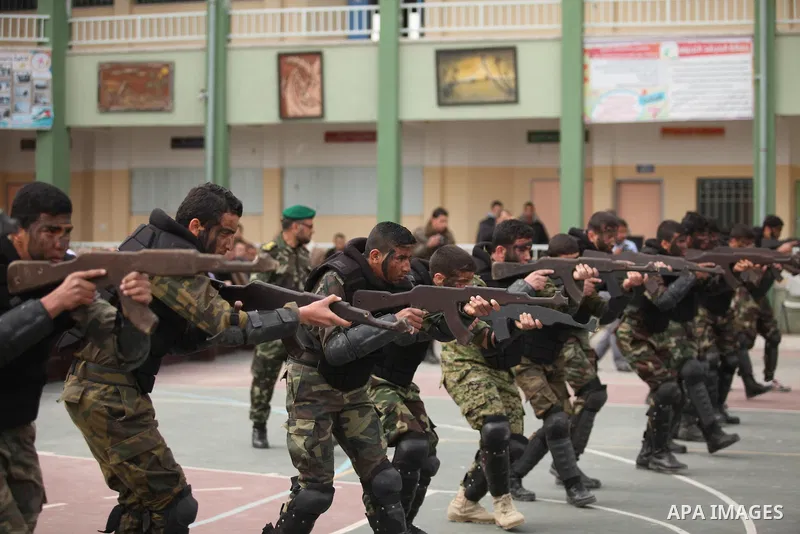 Palestinian students demonstrate their skills during a military-style show at a school in Rafah in the southern Gaza Strip March 28, 2016. Photo by Ashraf Amra