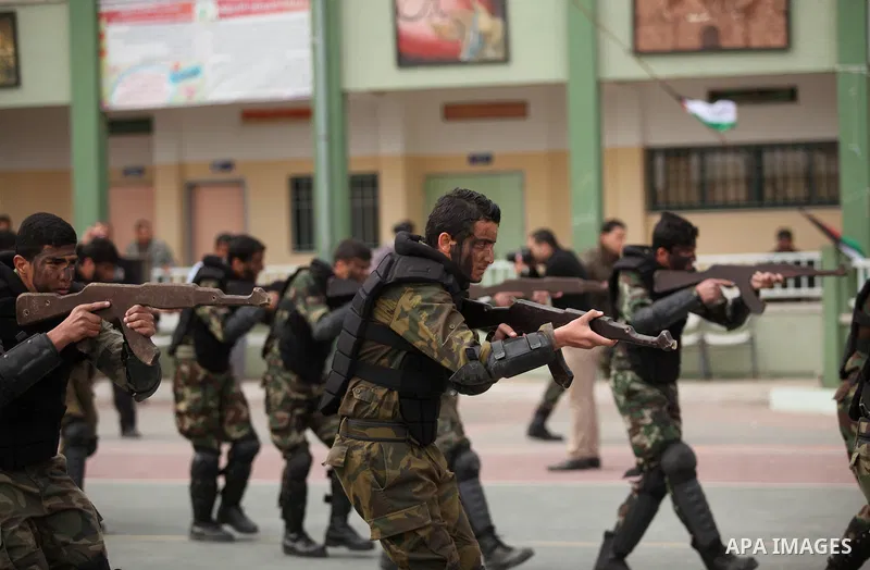 Palestinian students demonstrate their skills during a military-style show at a school in Rafah in the southern Gaza Strip March 28, 2016. Photo by Ashraf Amra