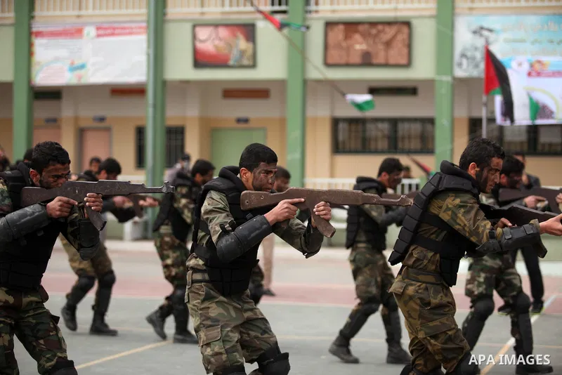 Palestinian students demonstrate their skills during a military-style show at a school in Rafah in the southern Gaza Strip March 28, 2016. Photo by Ashraf Amra