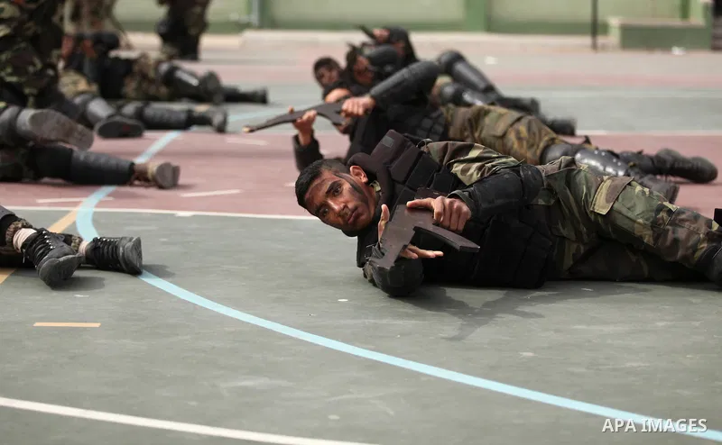 Palestinian students demonstrate their skills during a military-style show at a school in Rafah in the southern Gaza Strip March 28, 2016. Photo by Ashraf Amra