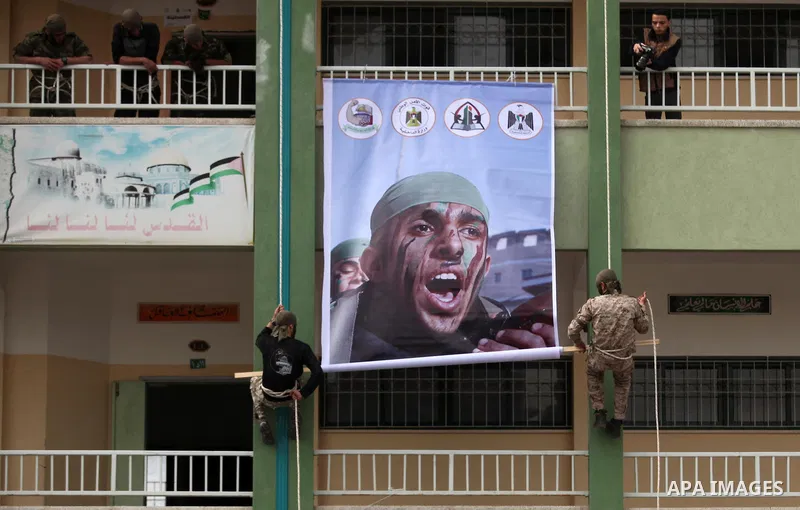 Palestinian students demonstrate their skills during a military-style show at a school in Rafah in the southern Gaza Strip March 28, 2016. Photo by Ashraf Amra