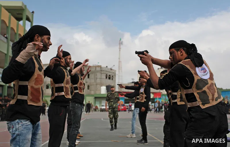 Palestinian students demonstrate their skills during a military-style show at a school in Rafah in the southern Gaza Strip March 28, 2016. Photo by Ashraf Amra
