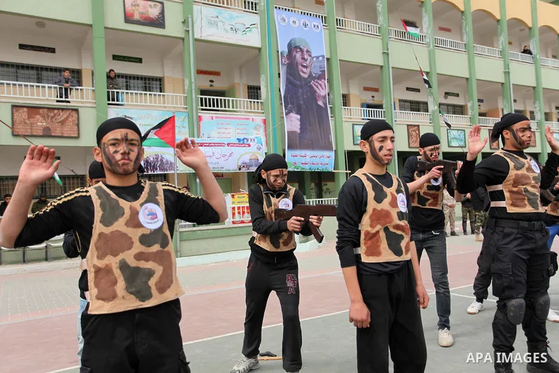 Palestinian students demonstrate their skills during a military-style show at a school in Rafah in the southern Gaza Strip March 28, 2016. Photo by Ashraf Amra